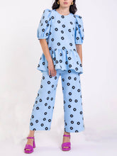 Pantalones anchos clásicos con bolsillo de margaritas